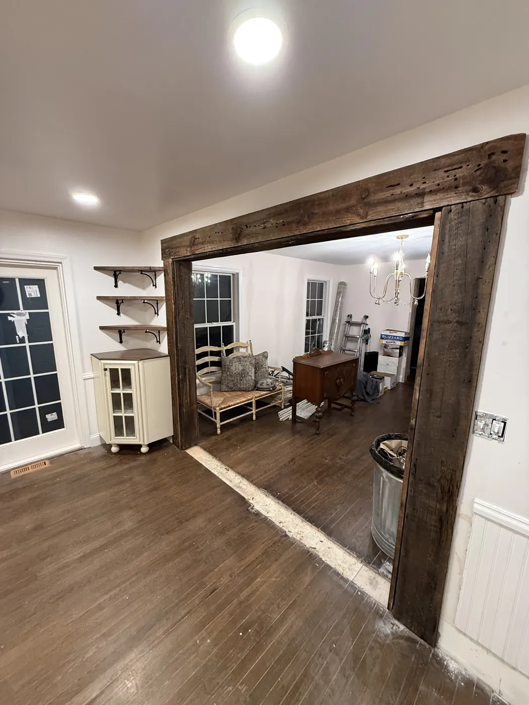 Reclaimed wood trim framing the adjacent room opening