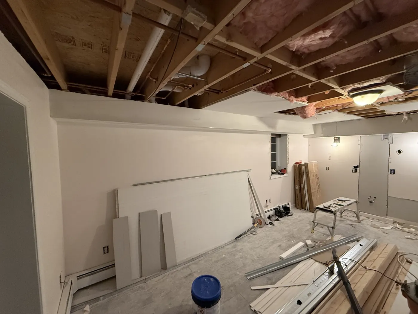 Ceiling and wall work during the basement renovation