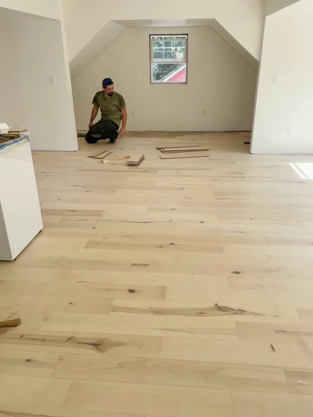 Wood flooring being installed in the sewing studio