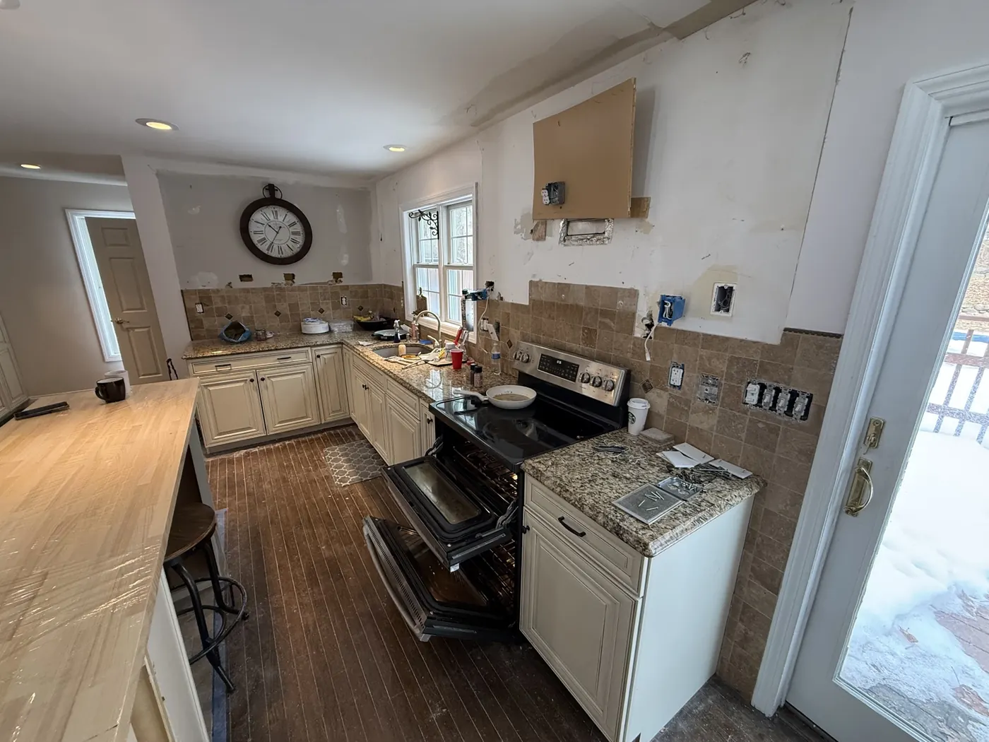 Kitchen wall and backsplash during early remodel work