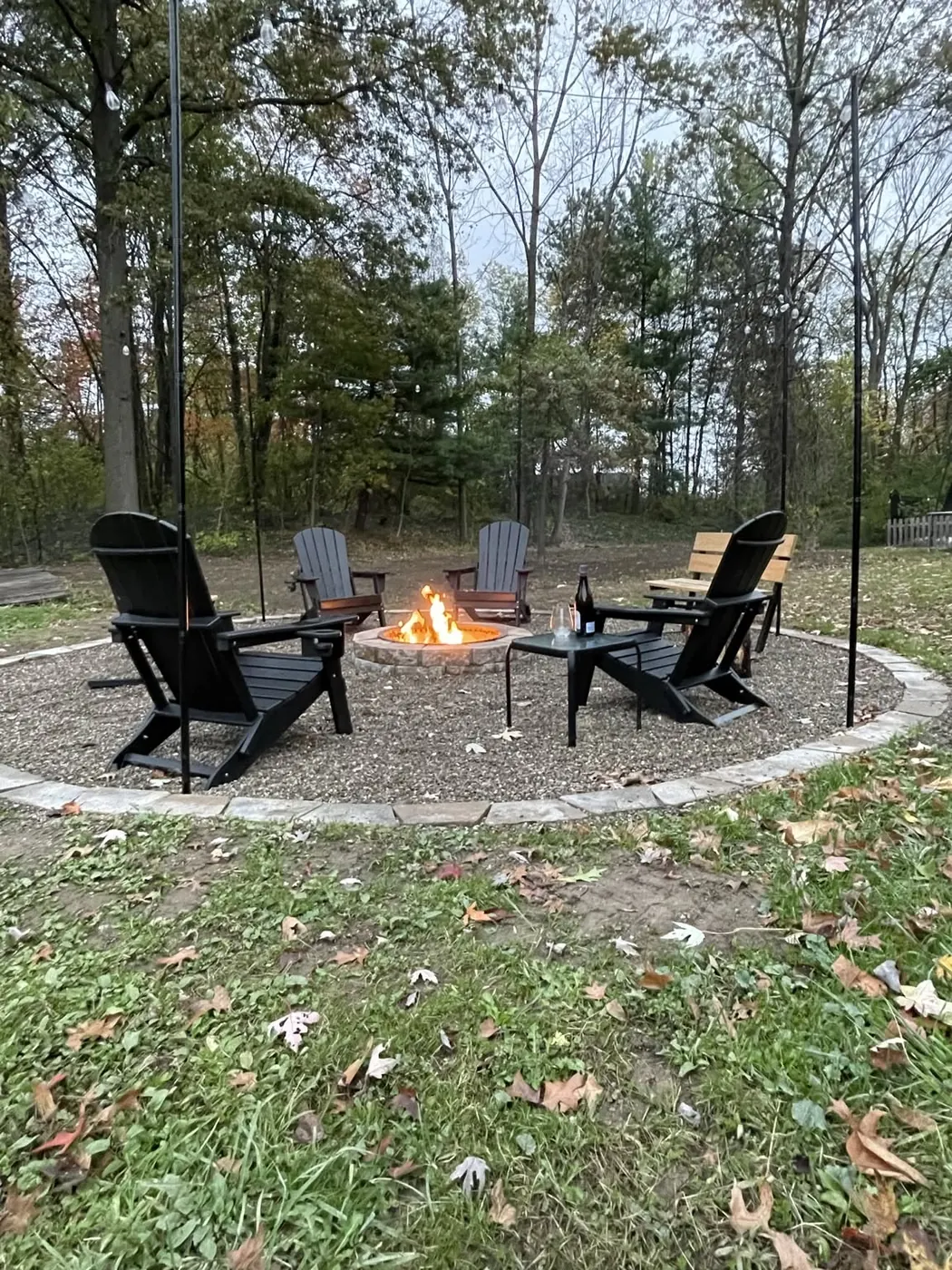Completed custom backyard fire pit with seating
