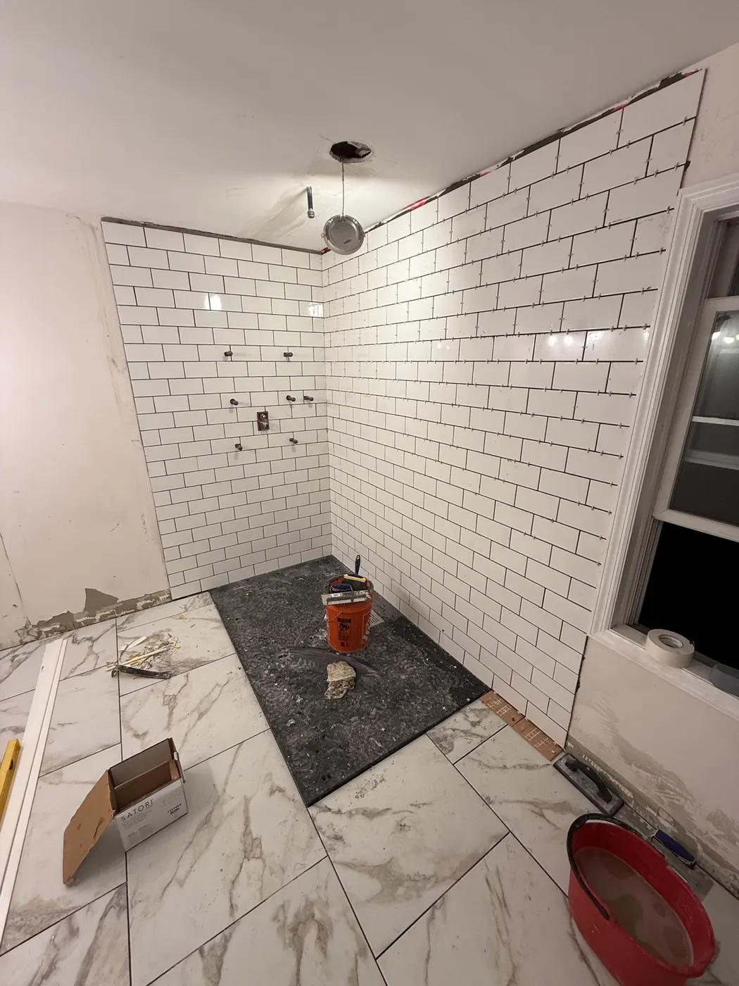 Subway tile installation in the shower
