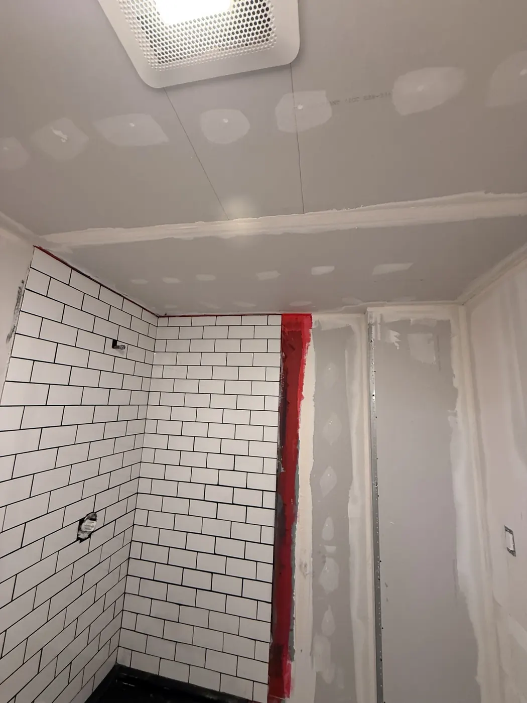 Wall and shower tile finishing work