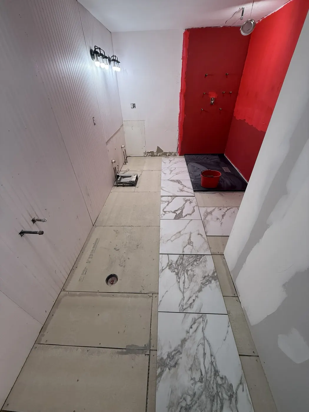 Bathroom floor tile installation in progress
